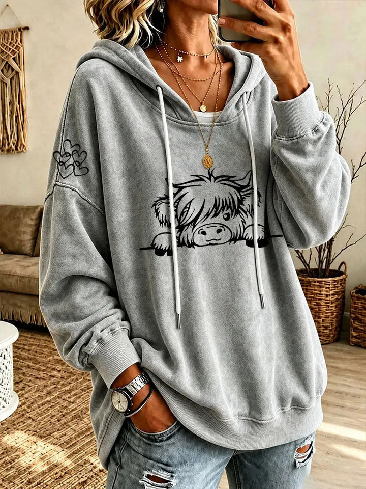 Noreli – Allover-Highland-Rinder-Print Strick-Kapuzenpullover