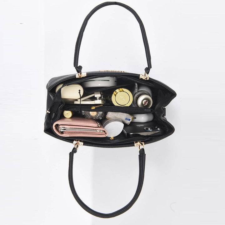 Nirela – Muschelform mit beschichteter Oberfläche Handtasche